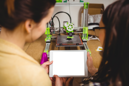 Graphic designers interacting using digital tablet