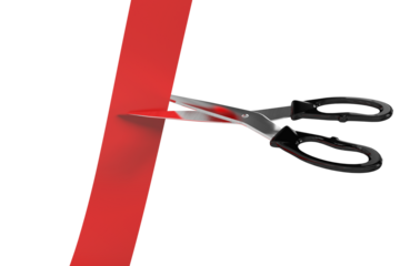 Scissors cutting red ribbon