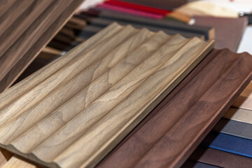 Samples of wooden panels. Modern trends in decor and interior design, construction and renovation. Close-up.