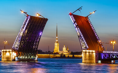Fototapeta na wymiar Open Palace bridge and Peter and Paul cathedral at white night, Saint Petersburg, Russia
