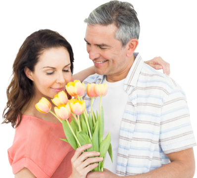Smiling couple with flowers bouquet