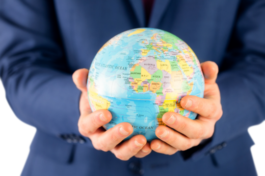 Hand of businessman holding terrestrial globe 