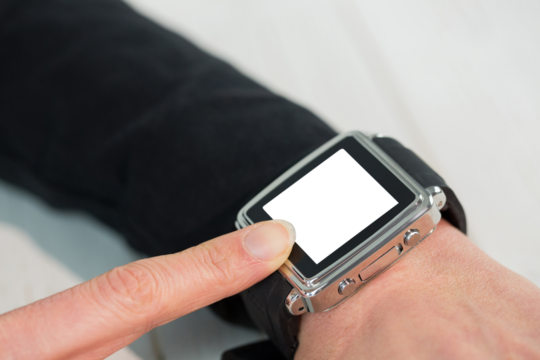 Businesswoman using a smart watch