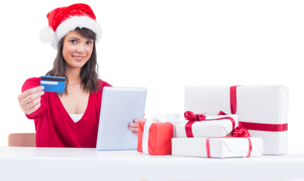 Festive brunette shopping online with tablet pc
