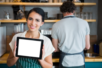 Portrait of woman holding digital tablet