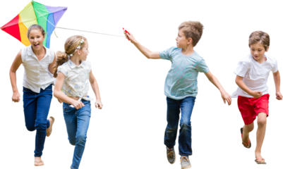 Full length of boy holding kite running with friends