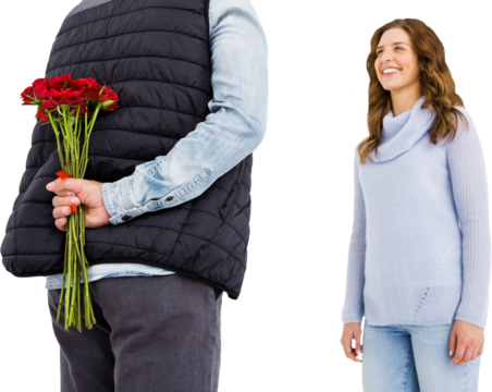 Man hiding roses behind back from woman