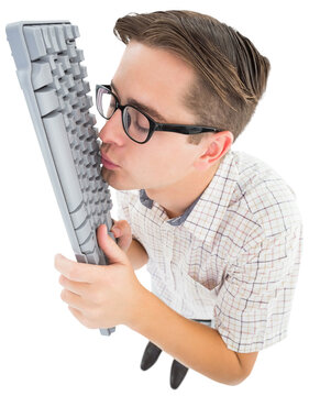 Geeky hipster kissing his keyboard