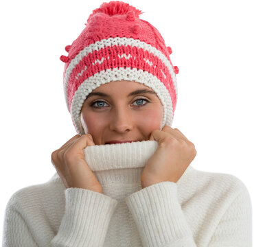 Portrait of woman covering face with turtleneck sweater