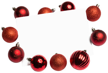 Red christmas baubles surrounding white page