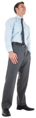 Happy businessman standing with hands in pockets