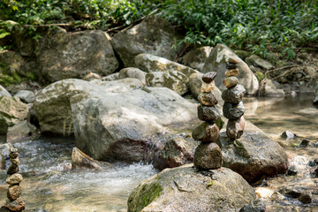 representation of inner balance with stones in a river