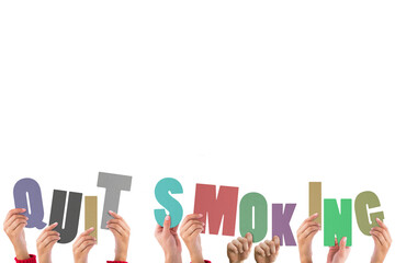 Colorful alphabet spelling quit smoking held up by people 