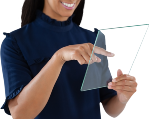 Mid section of smiling female executive using glass interface