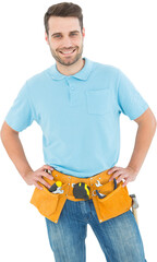 Happy carpenter standing with hands on hips 