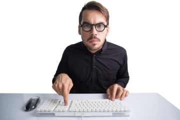 Concentrated businessman typing on keyboard 