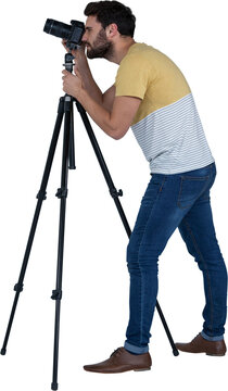 Full length side of photographer photographing through camera