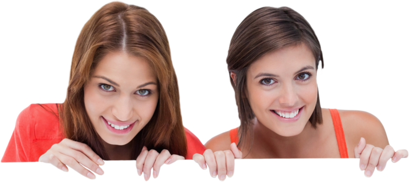 Teenage girls smiling while holding a blank poster and hiding behind it
