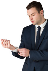 Businessman adjusting his cuffs on shirt