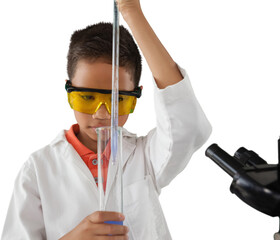 Naklejka premium Boy pipetting against white background