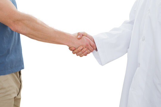 Mid section of a doctor and patient shaking hands