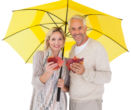 Portrait of happy couple under yellow umbrella