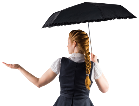 Pretty redhead businesswoman holding umbrella