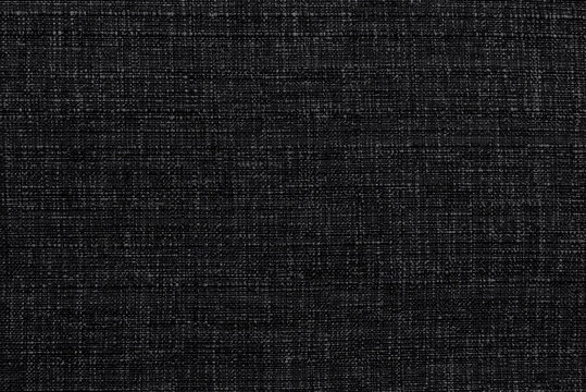 Carbon fiber background. Texture of black fabric for tailoring, Cloth