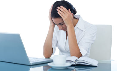 Upset businesswoman sitting at desk