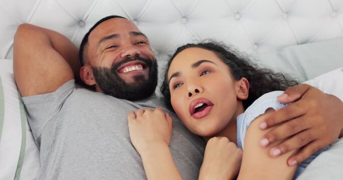 Couple in bed together, conversation and relax at home with communication, gossip and funny story with happy people. Relationship, commitment and trust, love and care with man and woman bonding