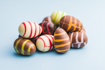 Chocolate easter eggs on blue background.
