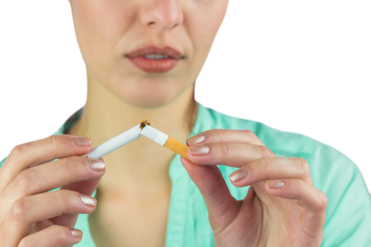 Close-up of woman holding cigarette 