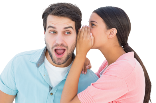 Brunette whispering secret to her boyfriend