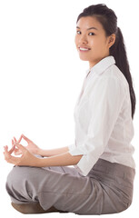 Businesswoman sitting in lotus pose