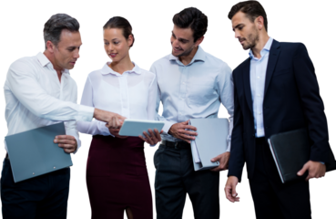 Business people holding files discussing over tablet