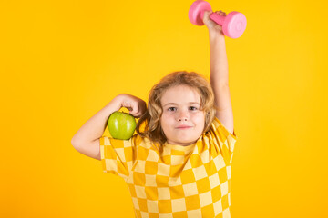 Fototapeta na wymiar Child workout. Kid sport. Child exercising with dumbbells. Sporty child with dumbbell.