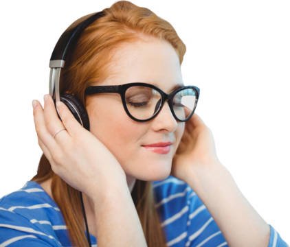 Beautiful redhead woman enjoying music from headphones - Powered by Adobe