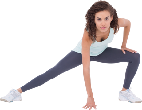 Fit woman stretching her legs