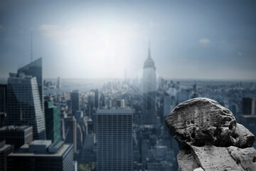 Large rock overlooking dark city
