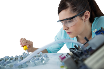Woman repairing computer motherboard
