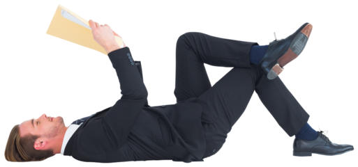 Relaxed businessman lying and reading document