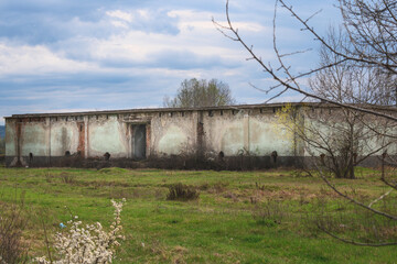 Fototapeta na wymiar Abandoned building. An old abandoned warehouse.
