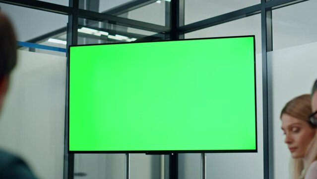 Business colleagues working mockup screen tv. Partners watching presentation