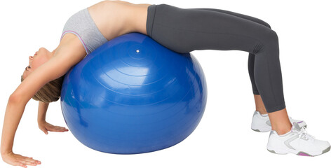 Fit young woman stretching on fitness ball