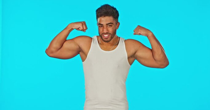 Fitness, green screen and man flexing muscle on mockup space for information or tips on body growth in studio. Mock up, exercise and healthy motivation by Indian personal trainer or sports instructor