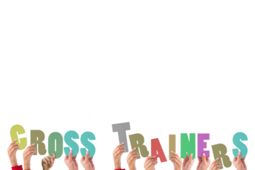 Hands holding up cross trainers