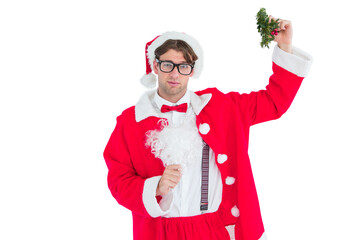 Geeky hipster in santa costume holding mistletoe  