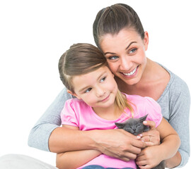 Smiling mother and daughter with cat 