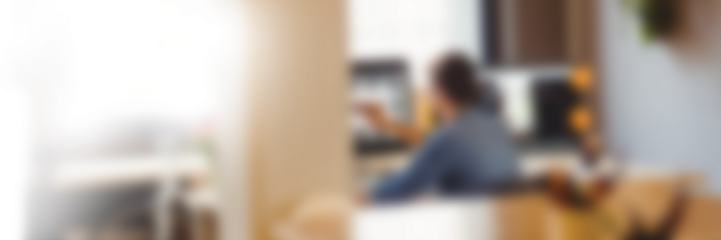 Defocused image of businessman sitting in office