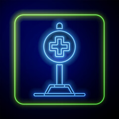 Glowing neon Medical map pointer with cross hospital icon isolated on blue background. Vector